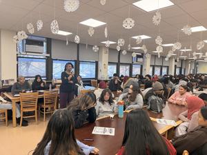 a woman giving a presentation to the students for access VR