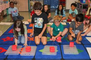Students participate in a "push-pull" experiment
