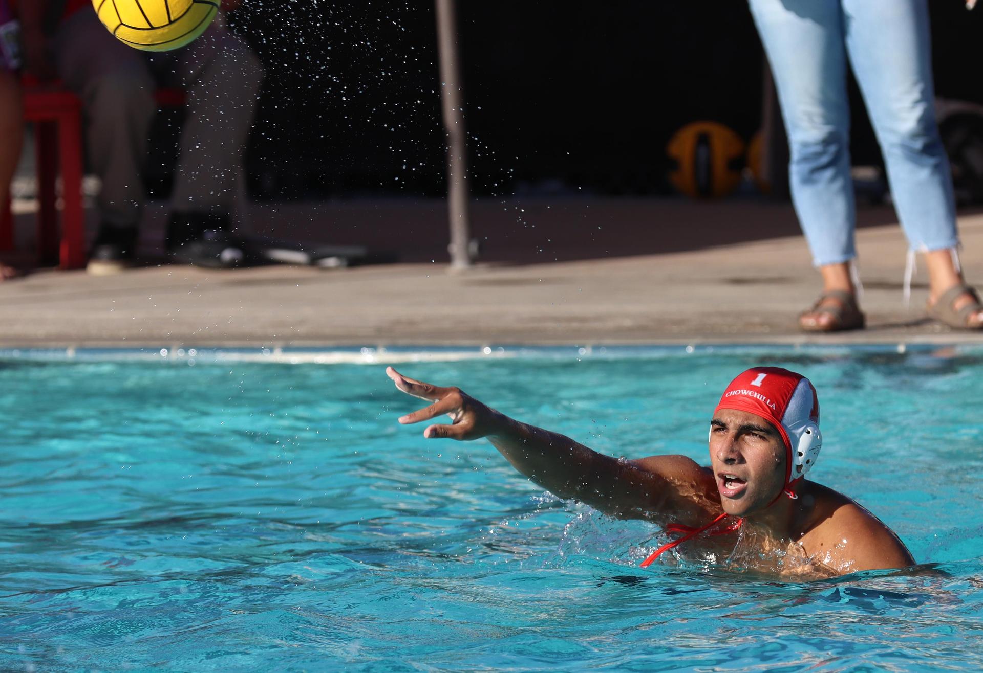 boys water polo players in action against san joaquin memorial