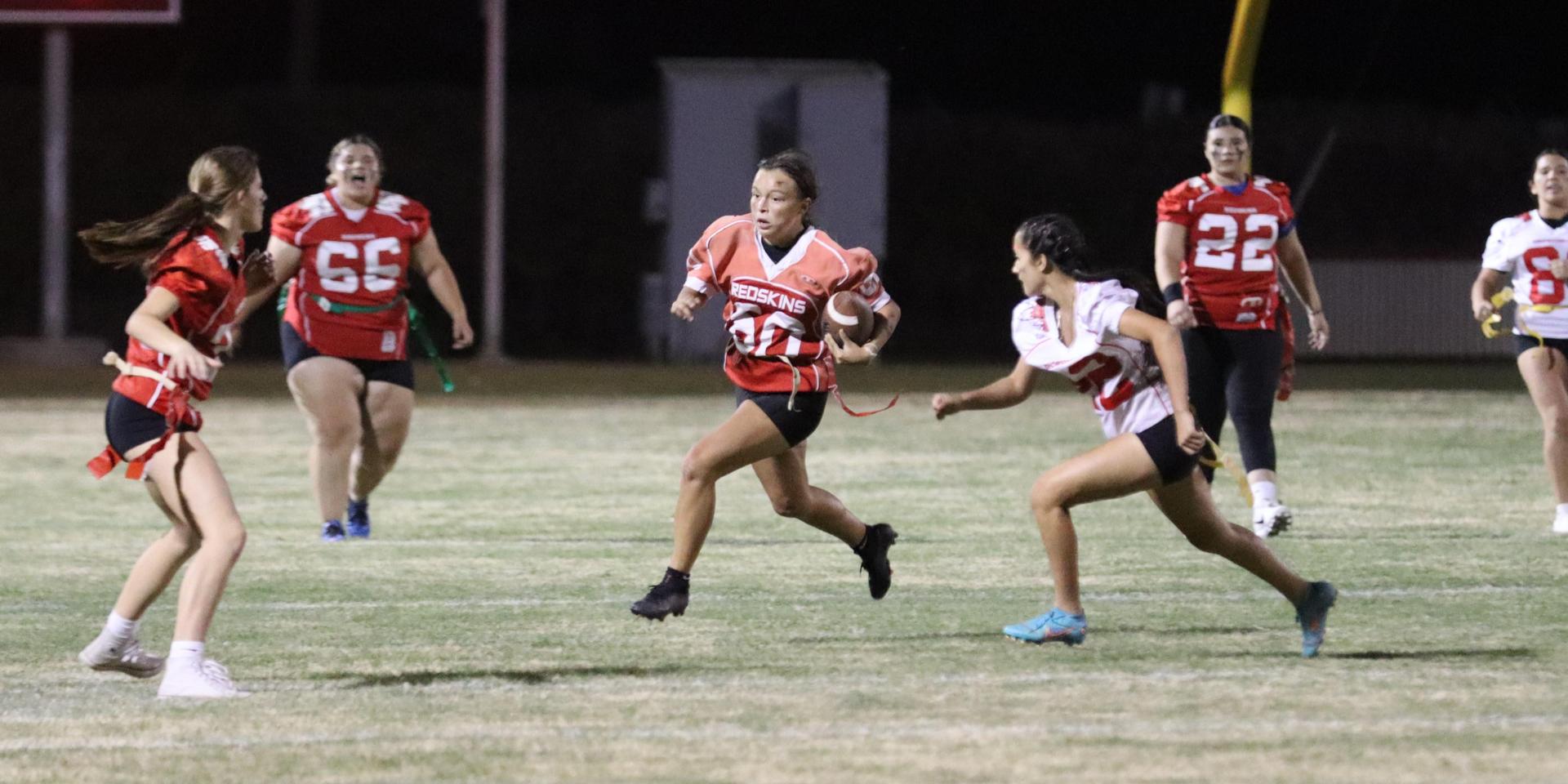girls playing flag football