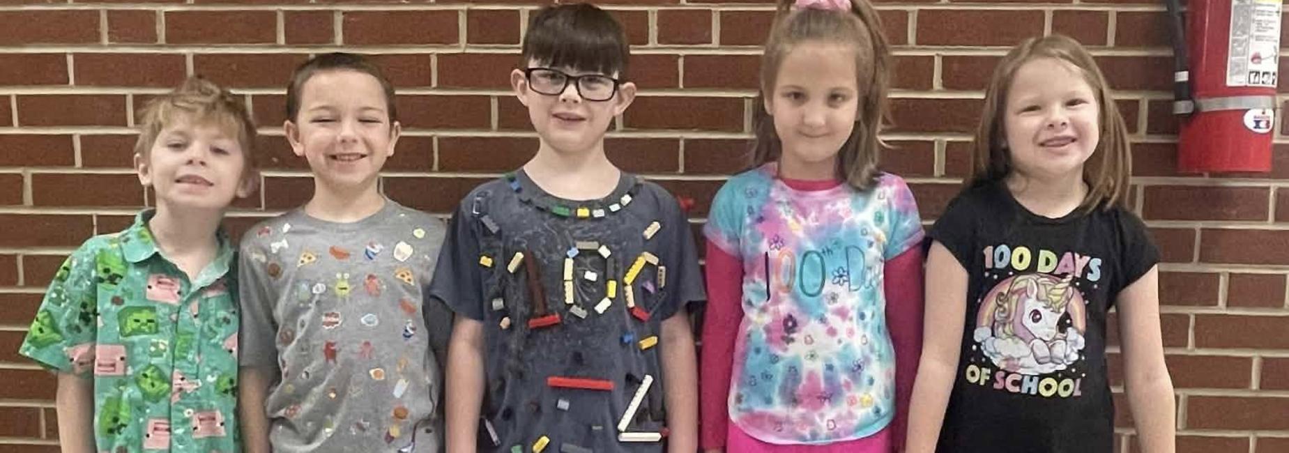 students celebrated 100 days of school wearing 100 items on their shirts.