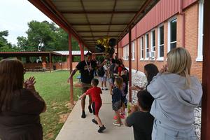 LC kids welcoming DeWaylon back from state.