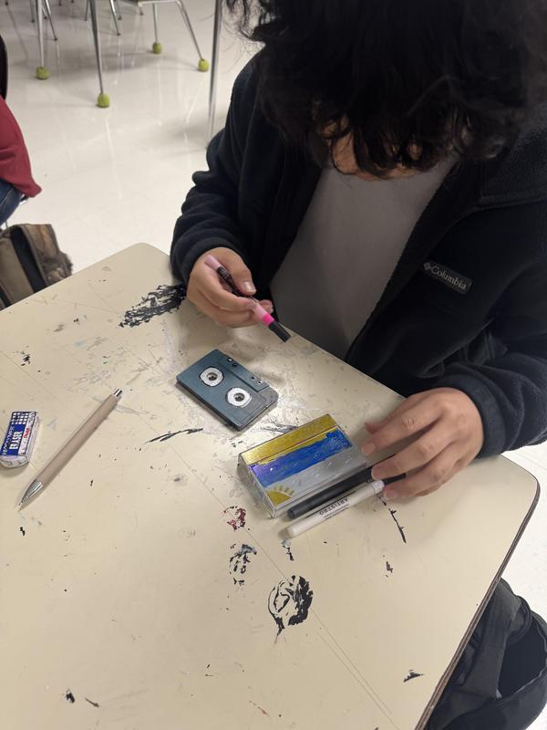 Students painting cassette tape