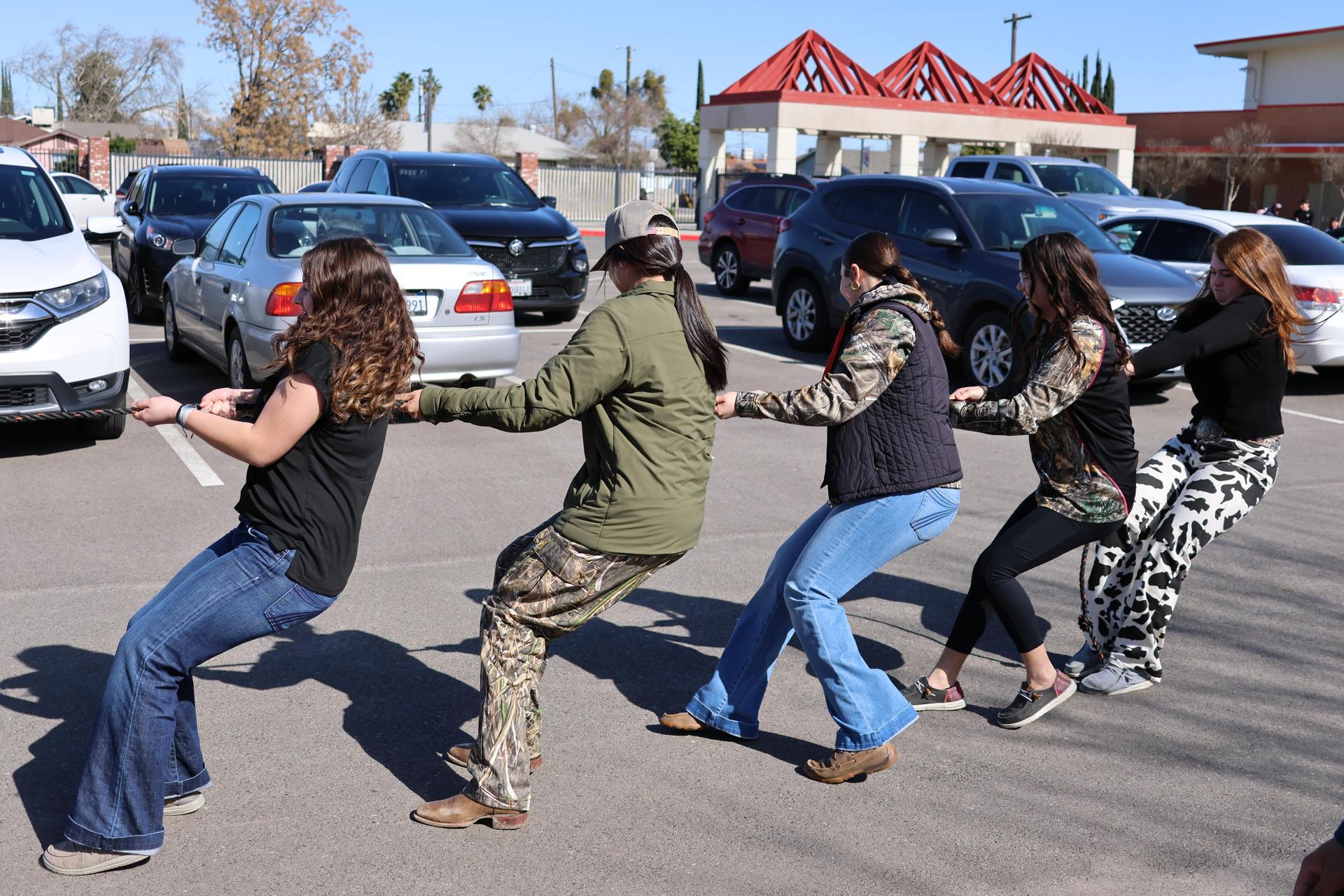 students and staff enjoying the truck pull