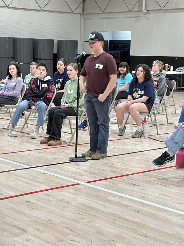 Students competing at spelling bee