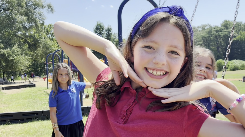 Southeast Elementary Student Smiling on the Playground