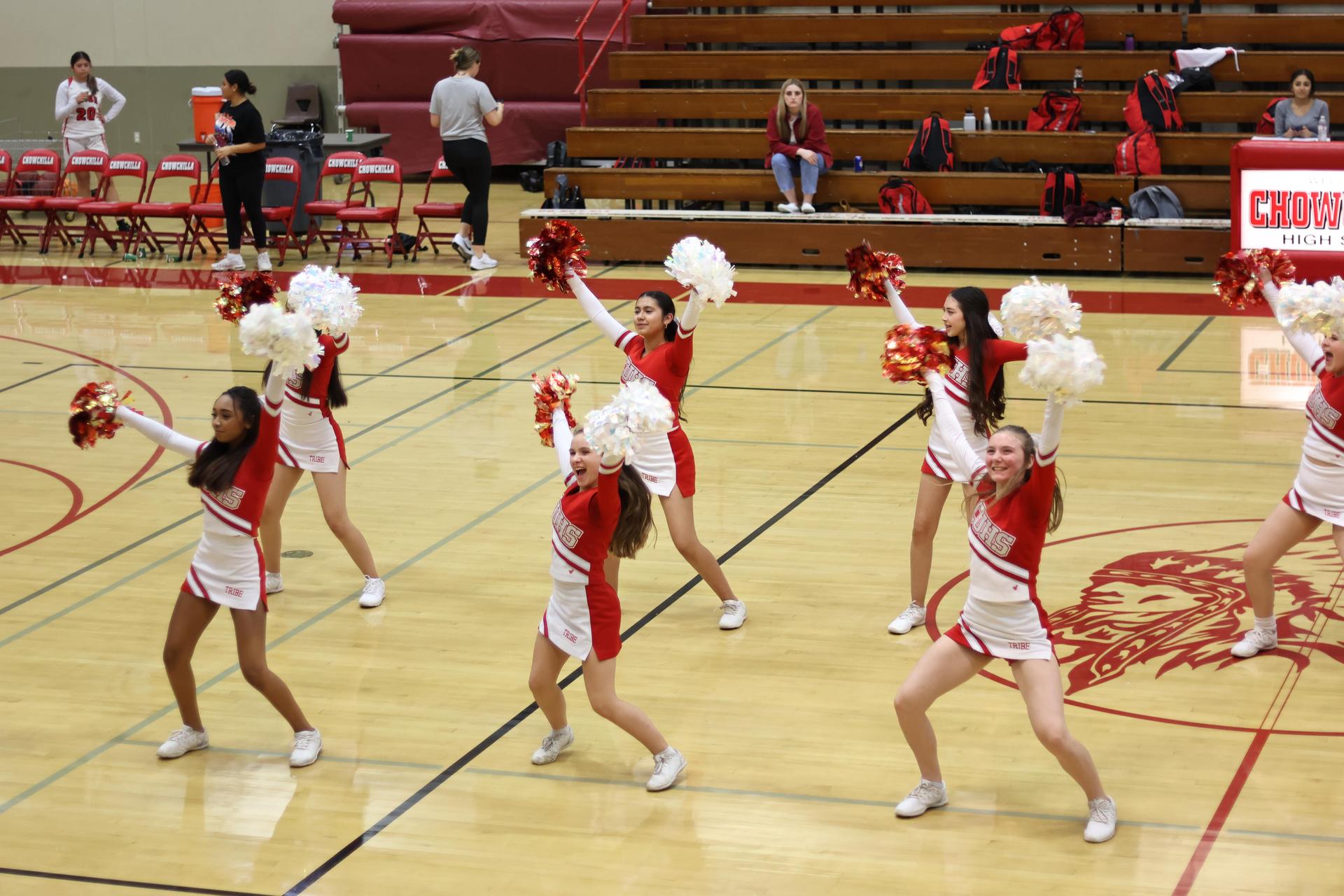 junior varsity cheerleaders cheering