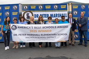 Staff Holding the banner