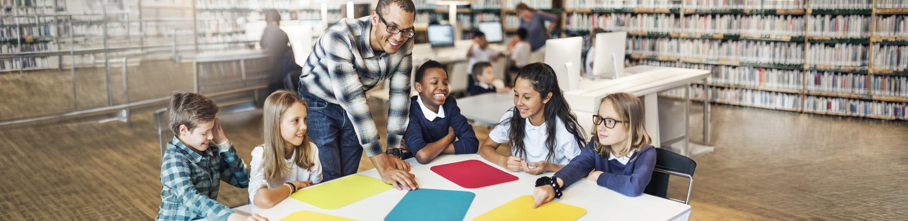 Diverse group of students with African American male teacher