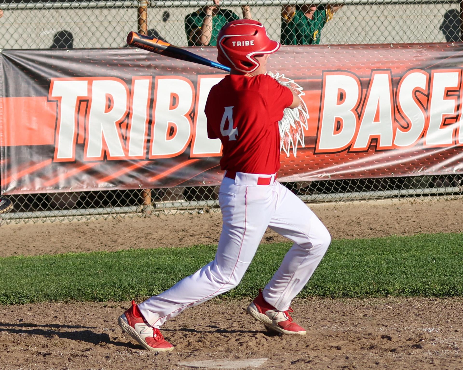junior varsity baseball players in action