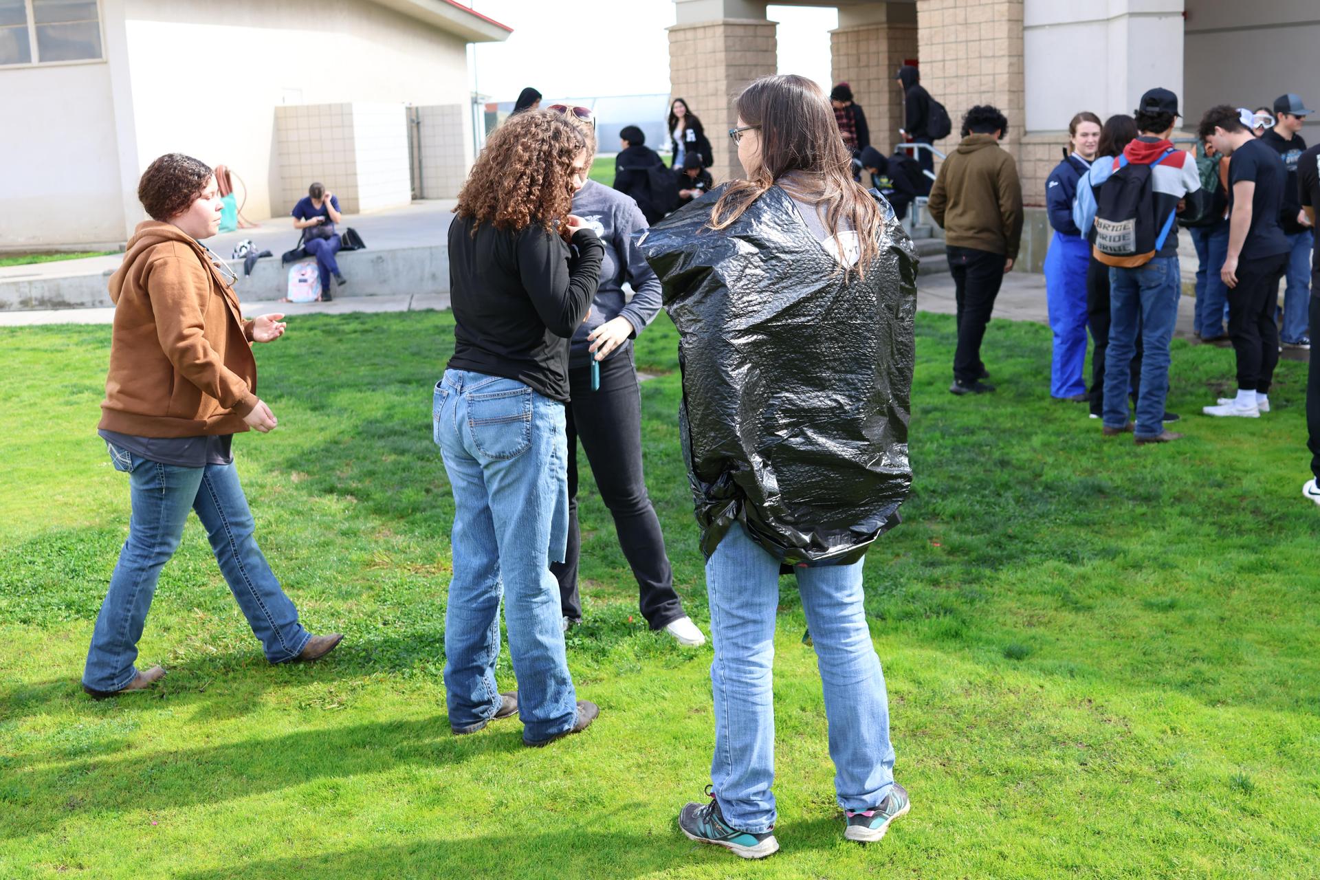students and staff enjoying the water balloon toss