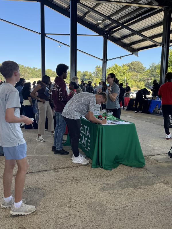 PHS students at the career fair, meeting with different people at tables