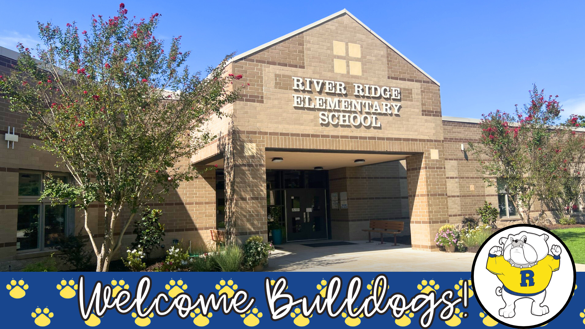 Entrance of River Ridge Elementary School with a welcome sign and decorative elements.