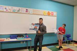 Chris Hannigan reads to the students
