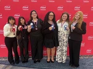 Student award winners pose with medals