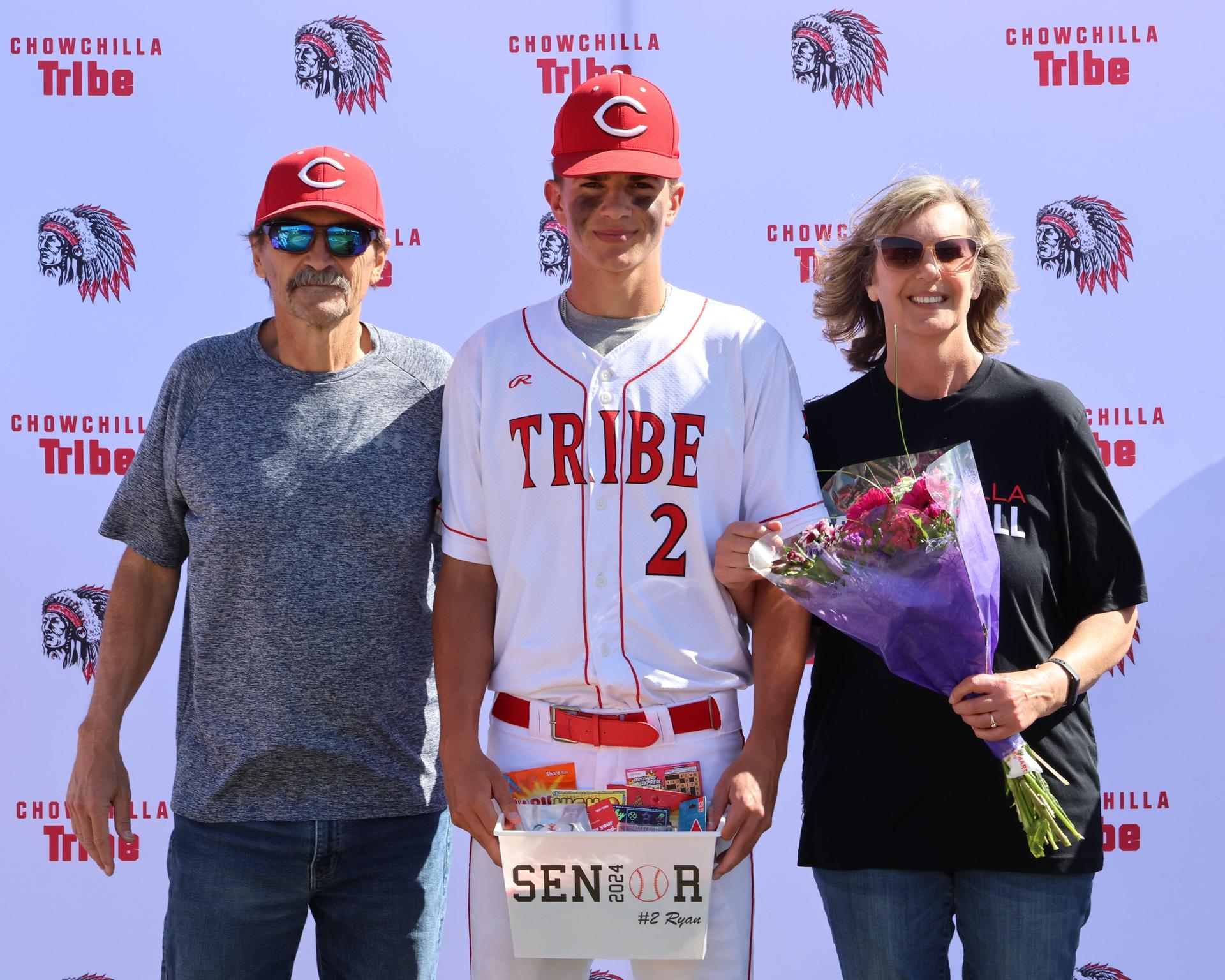 Seniors Posing With Teammates, Coaches, And Family