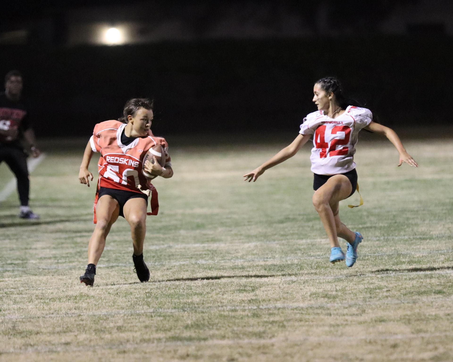 girls playing flag football