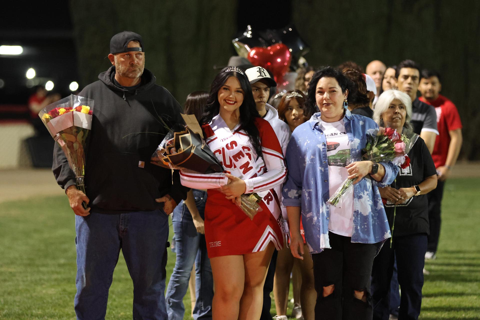 seniors and their escorts celebrating senior night