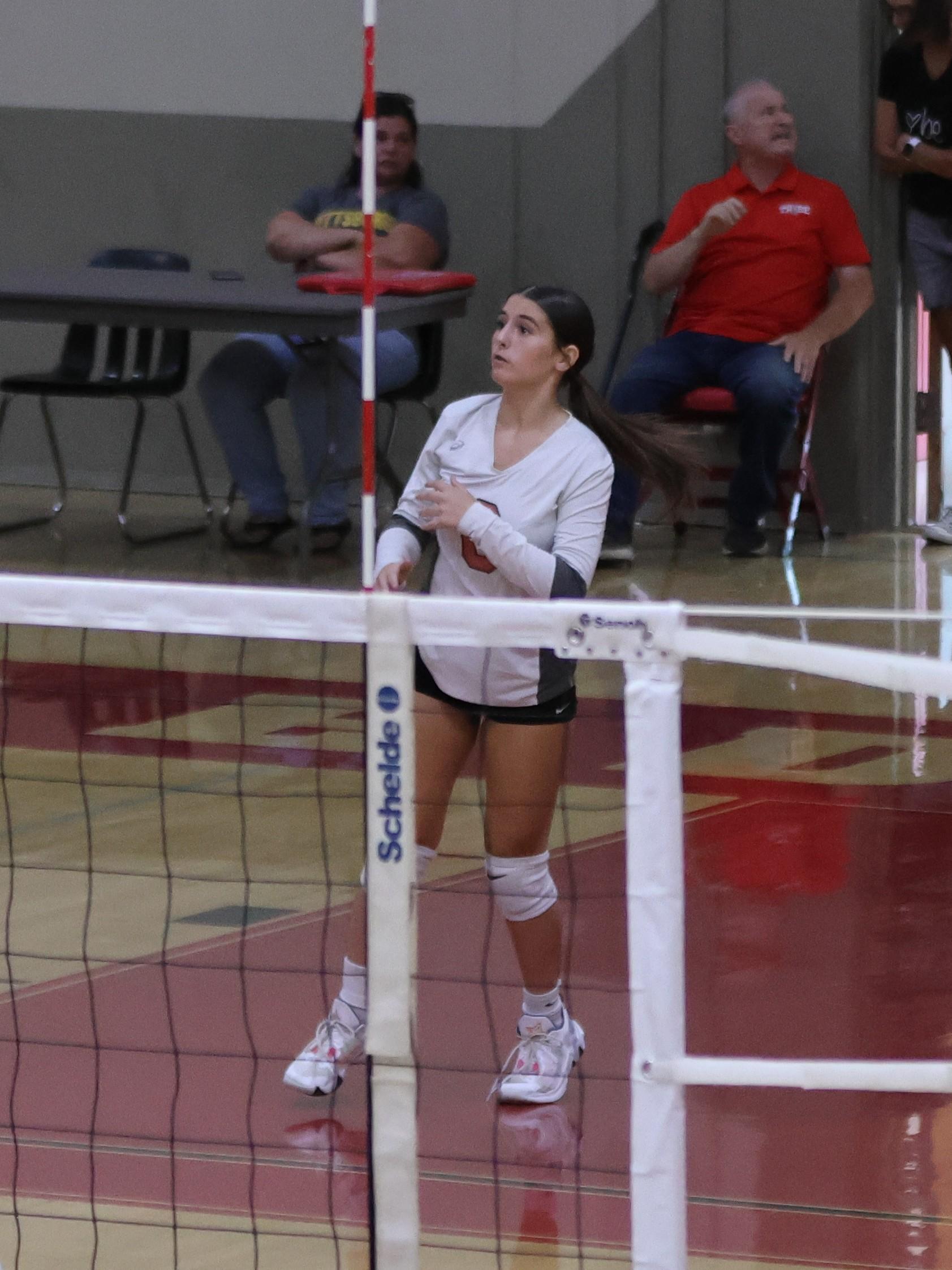junior varsity girls playing volleyball 126