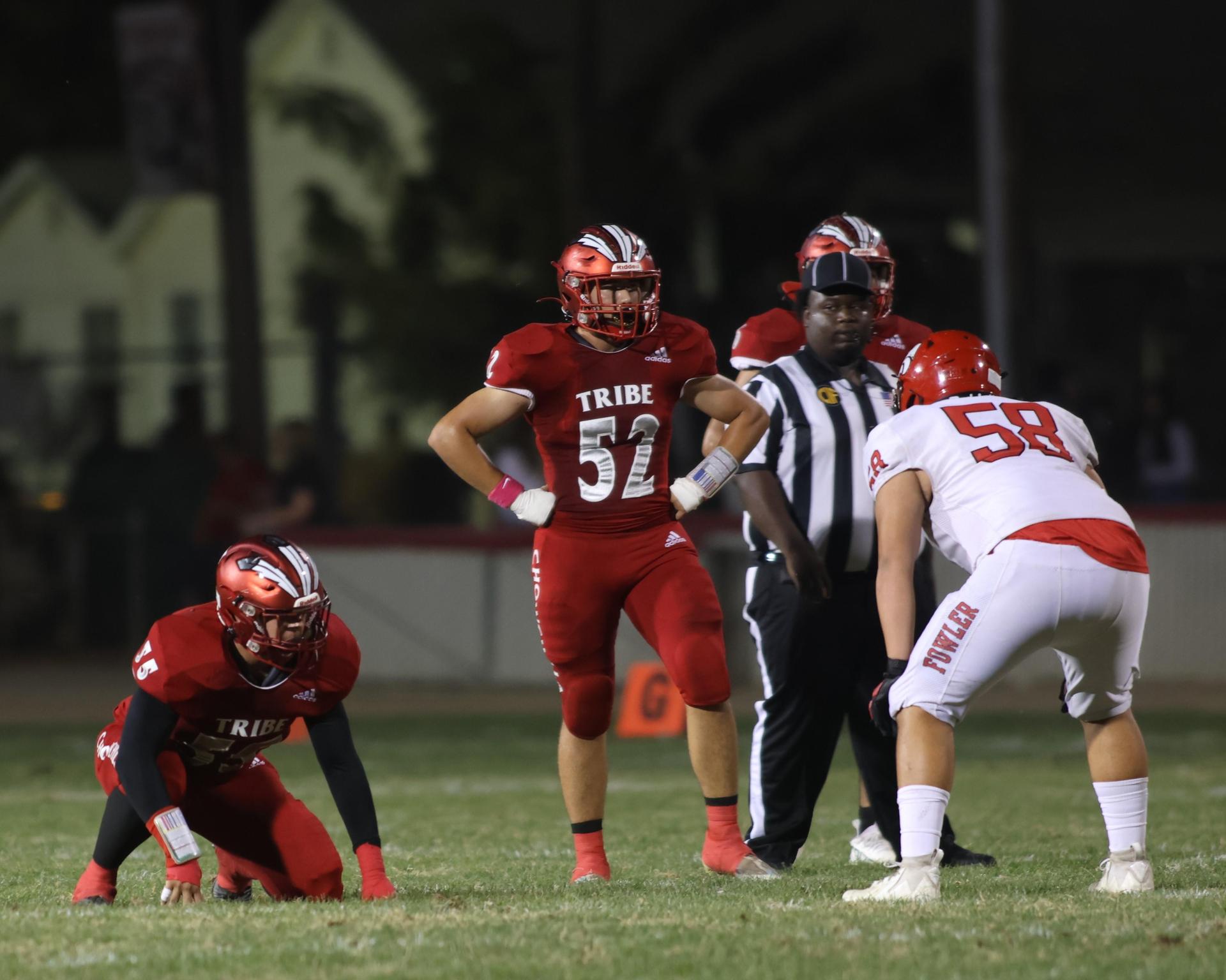 varsity boys playing football against Fowler