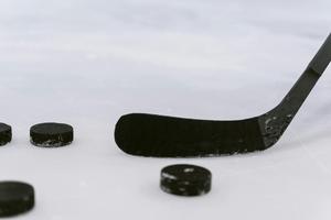 Hockey pucks and stick