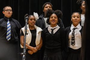 the 6th grade choir performs