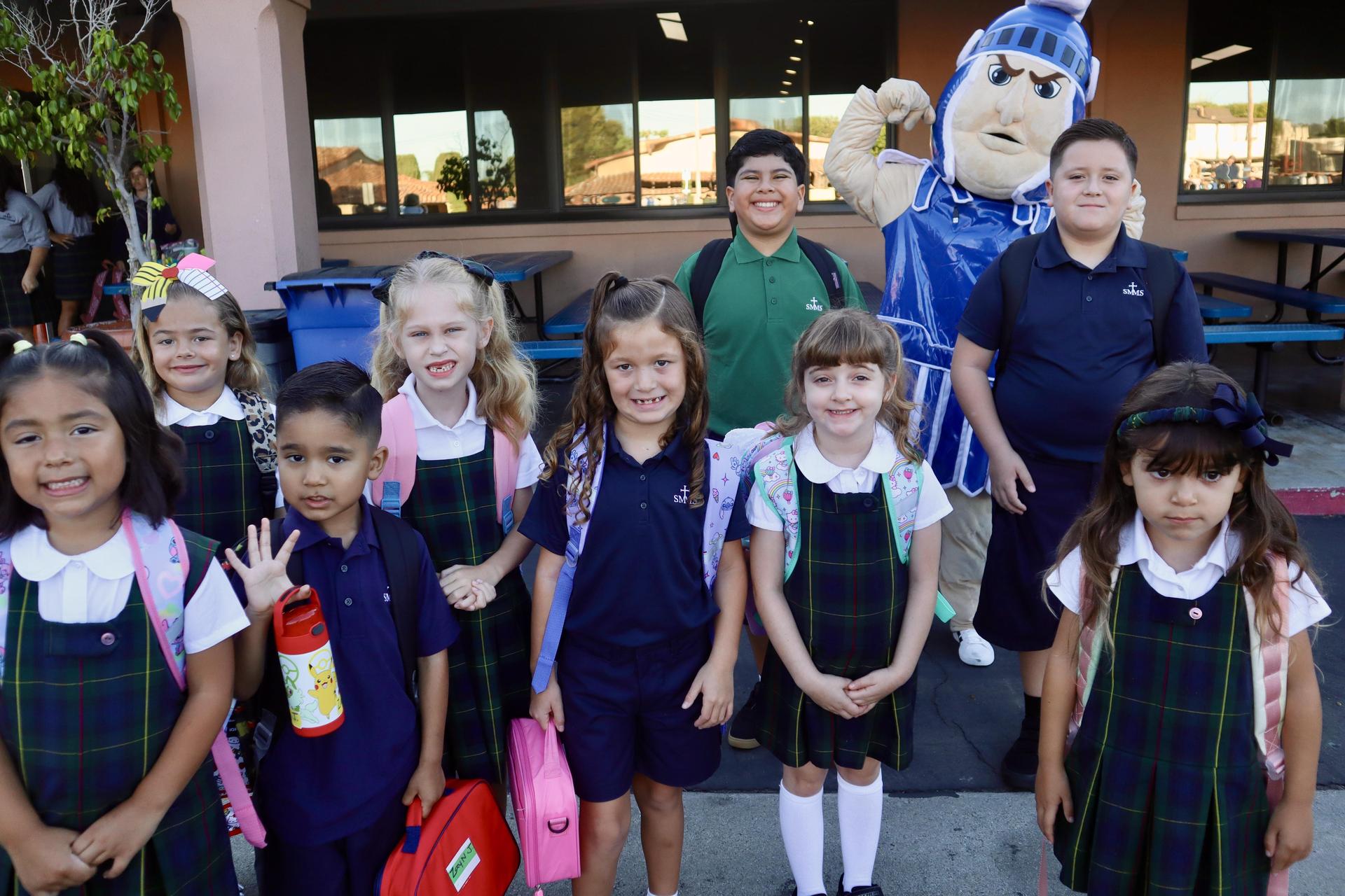 Spartan mascot and young students