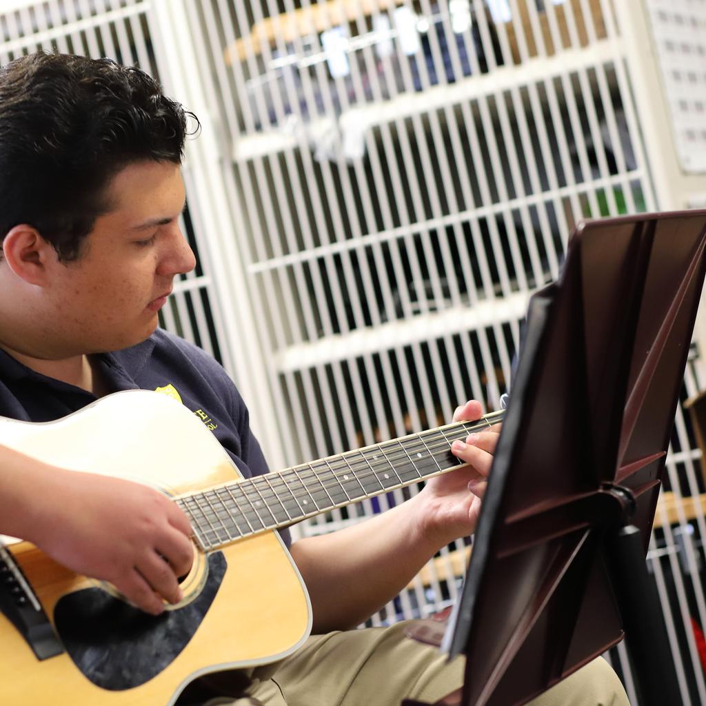 student playing Guitar