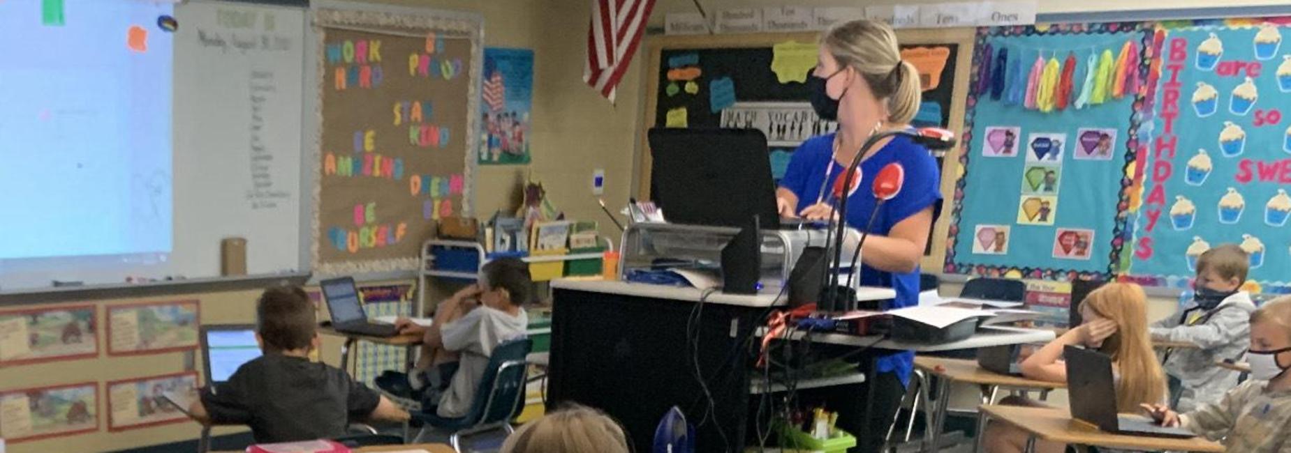 photo of Mrs. Trivette and her class using technology