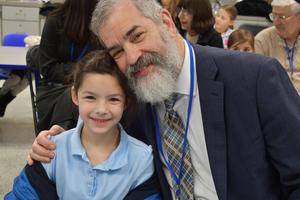 A grandfather with his granddaughter