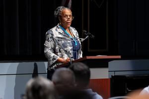 Dr. Cynthia Wallace speaks to the staff