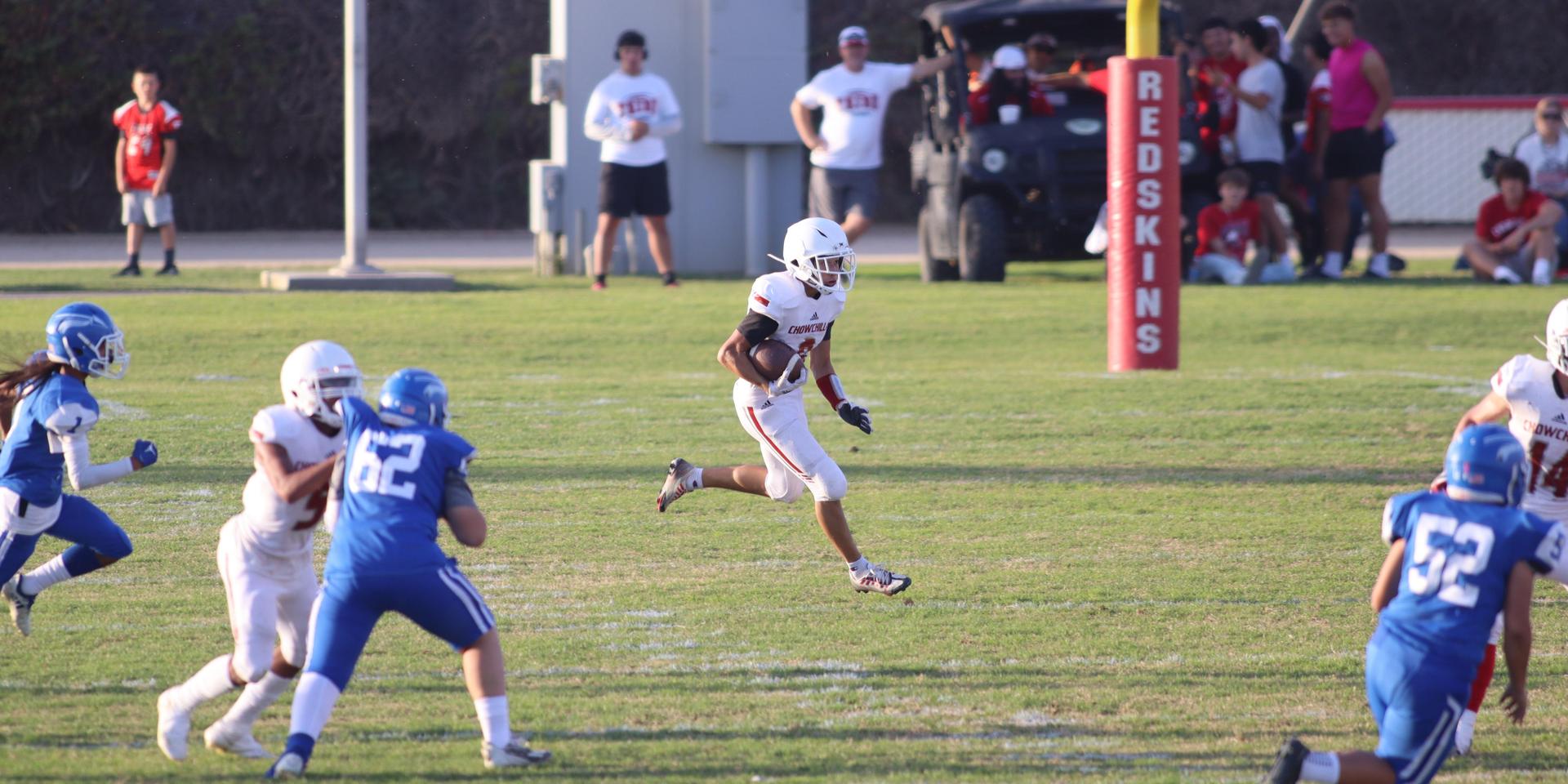 Junior Varsity football players in action against Caruthers