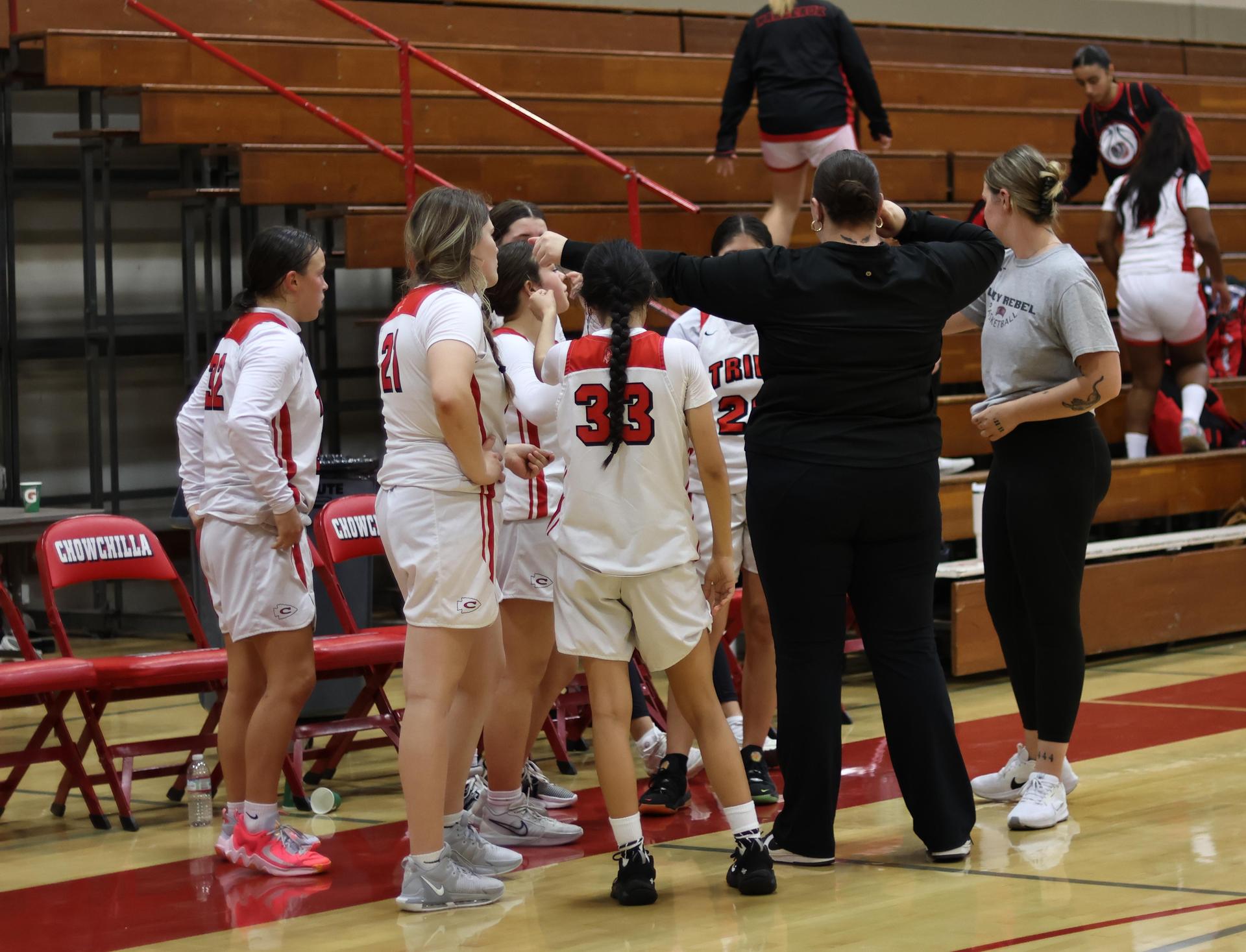 junior varsity girls playing basketball against parlier
