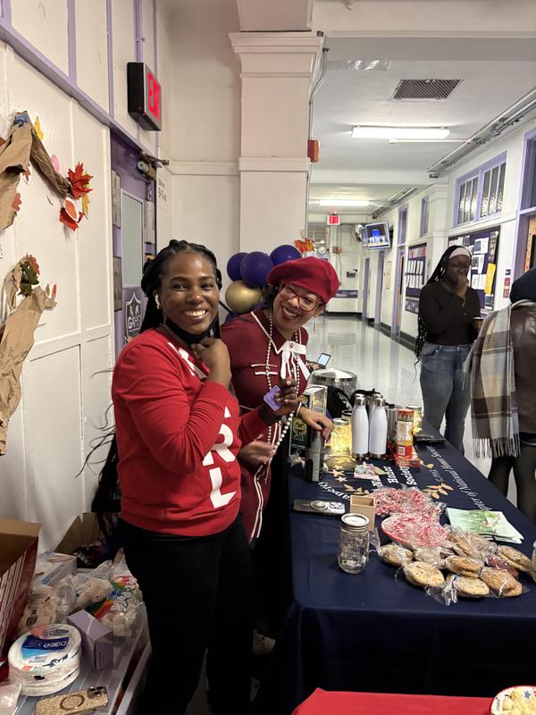 Picture of teacher serving food.