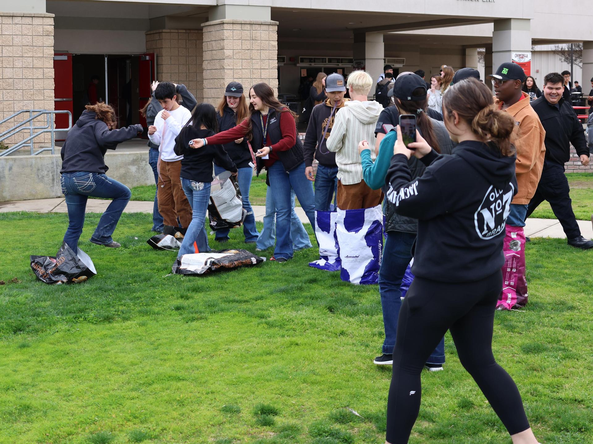 students and staff enjoying the feed bag relay