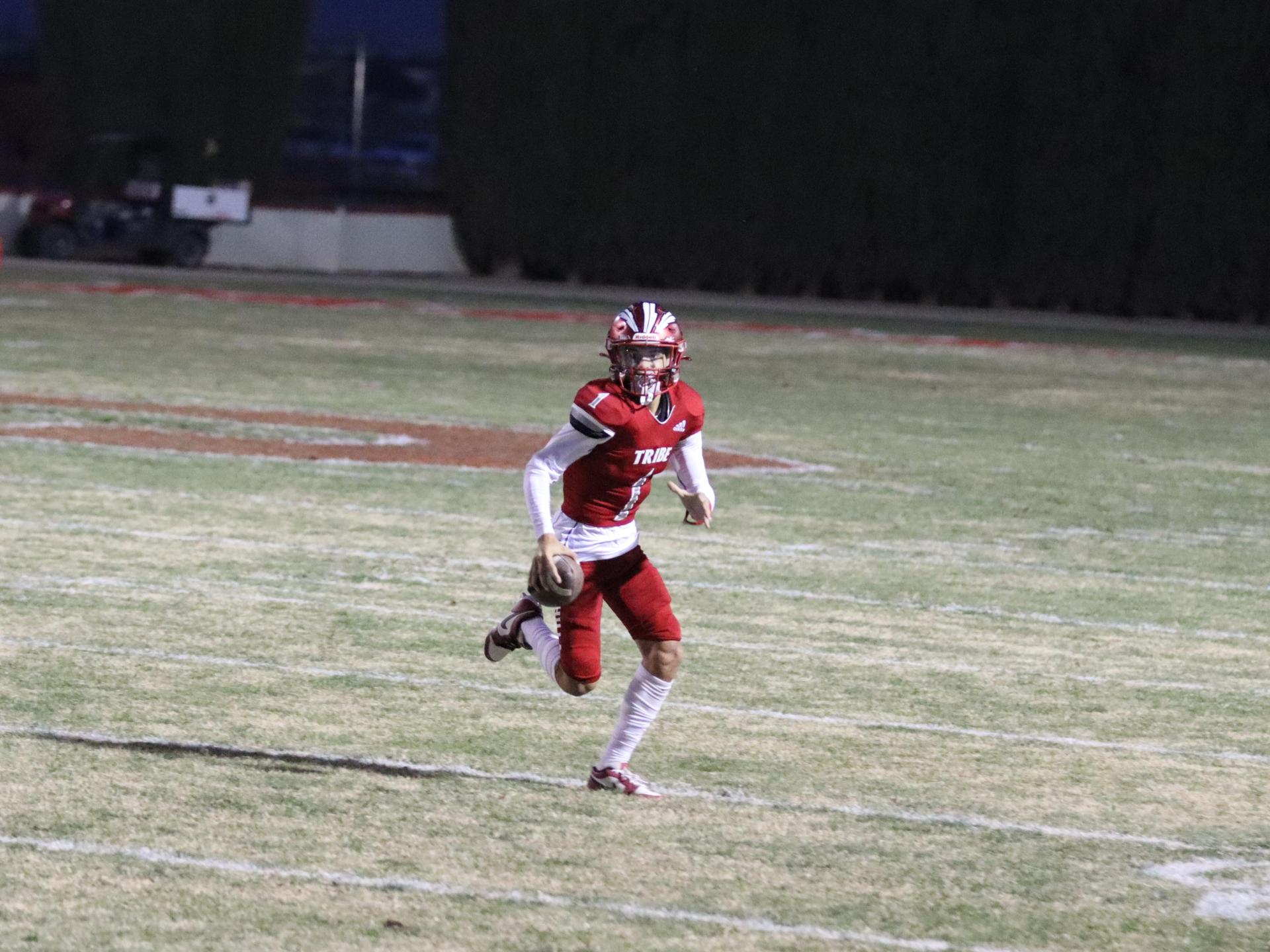 varsity football players in action against Riverdale