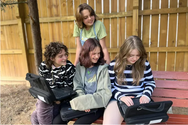 ArtSpace students learning together in outdoor classroom