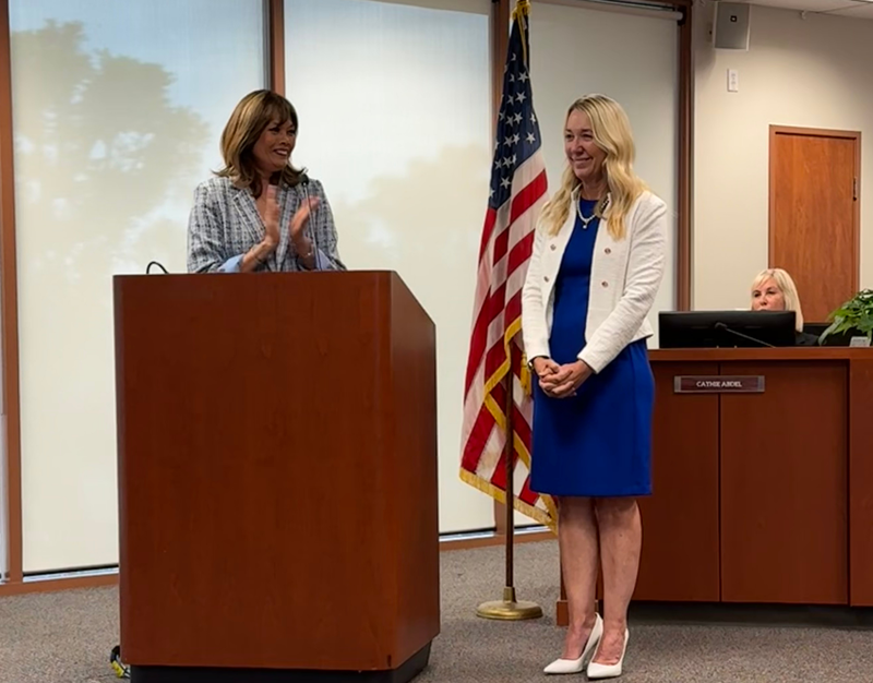 Katherine Stopp, Superintendent at podium in board room