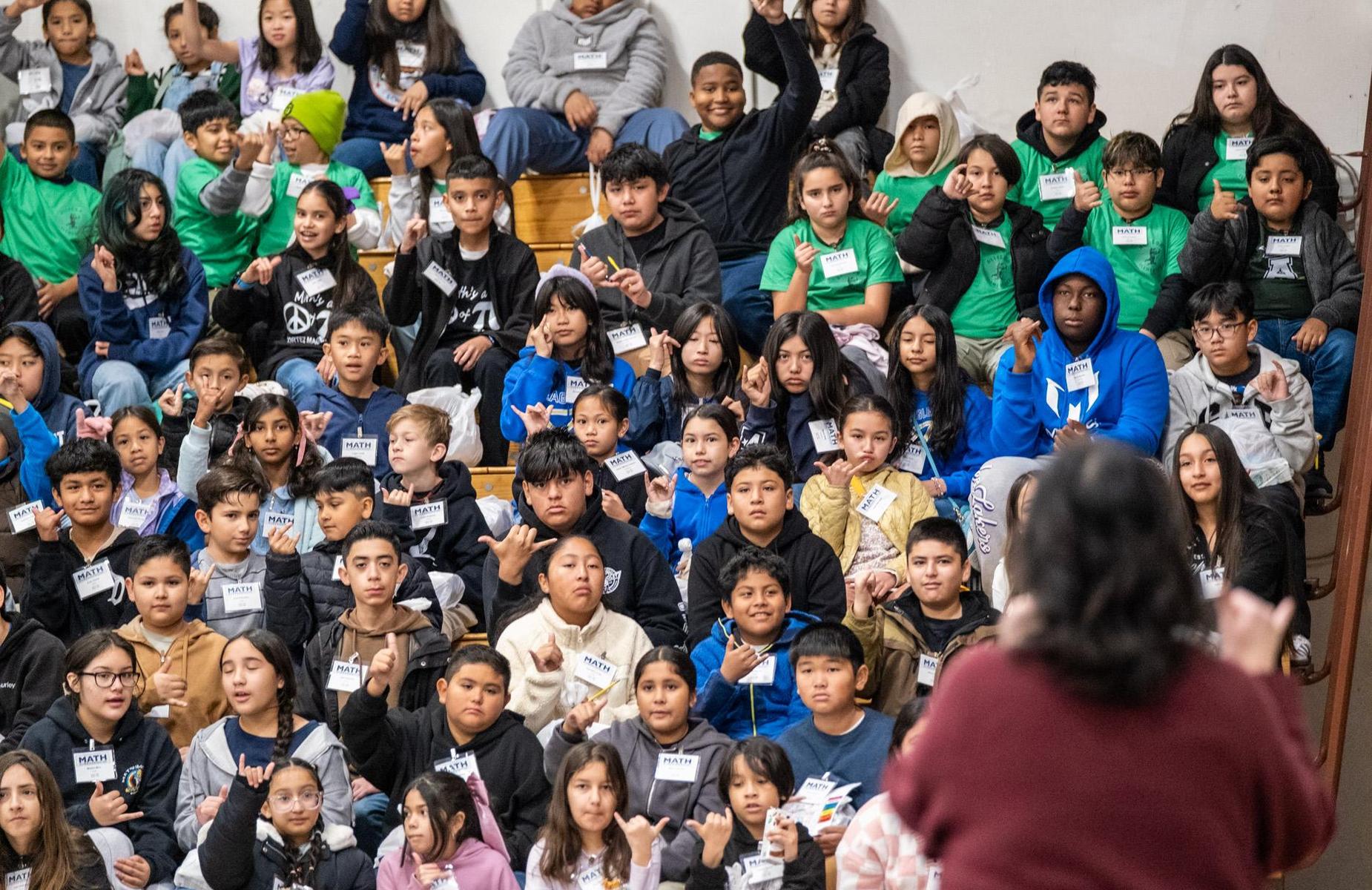 more than 40 students interact with teacher in math session