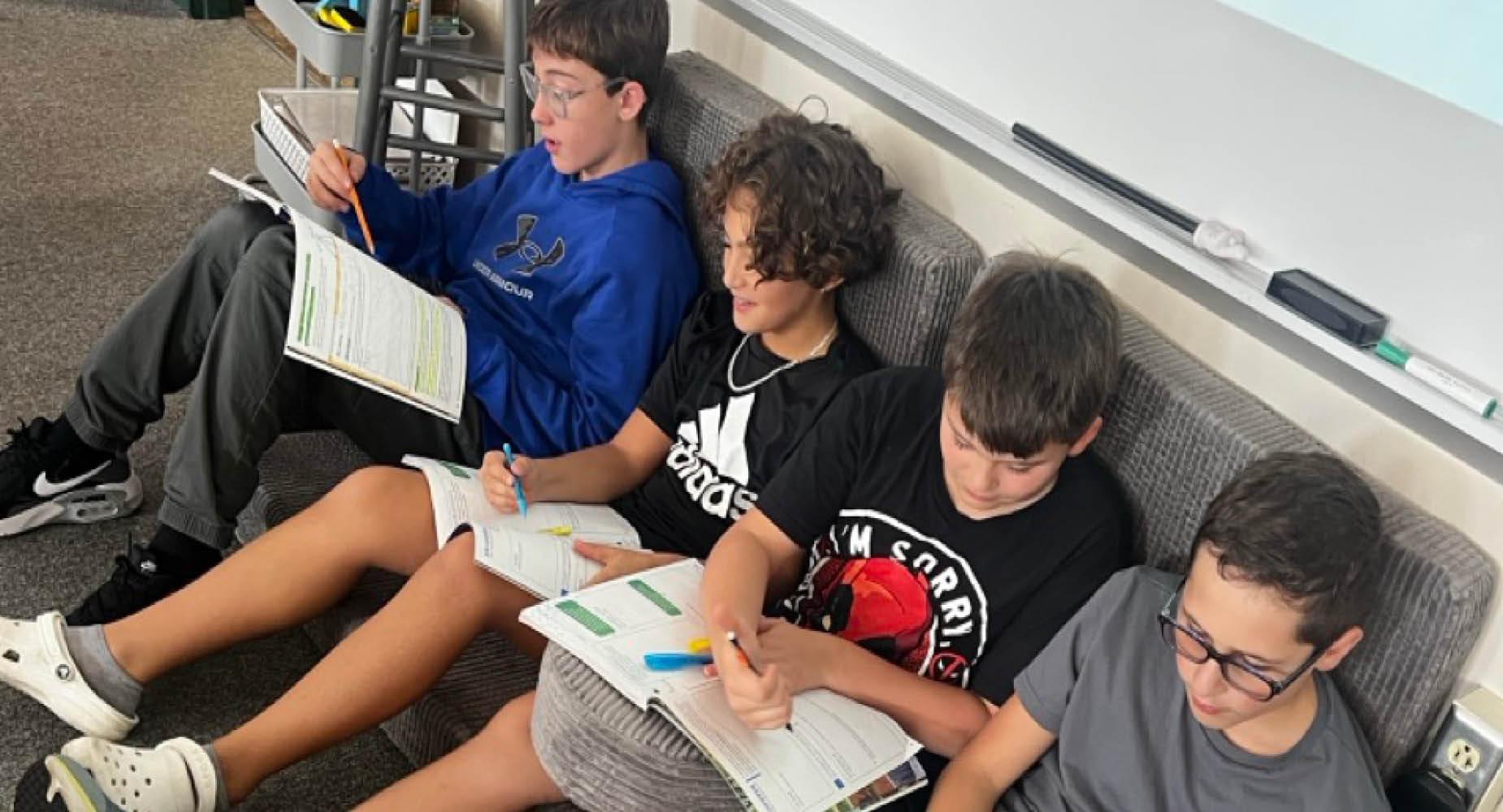 Gionaddi Cameron, Decklen Cosentino, Calix Hensler, and Issac Nahory work together in the new flexible seating at Trafford Middle School
