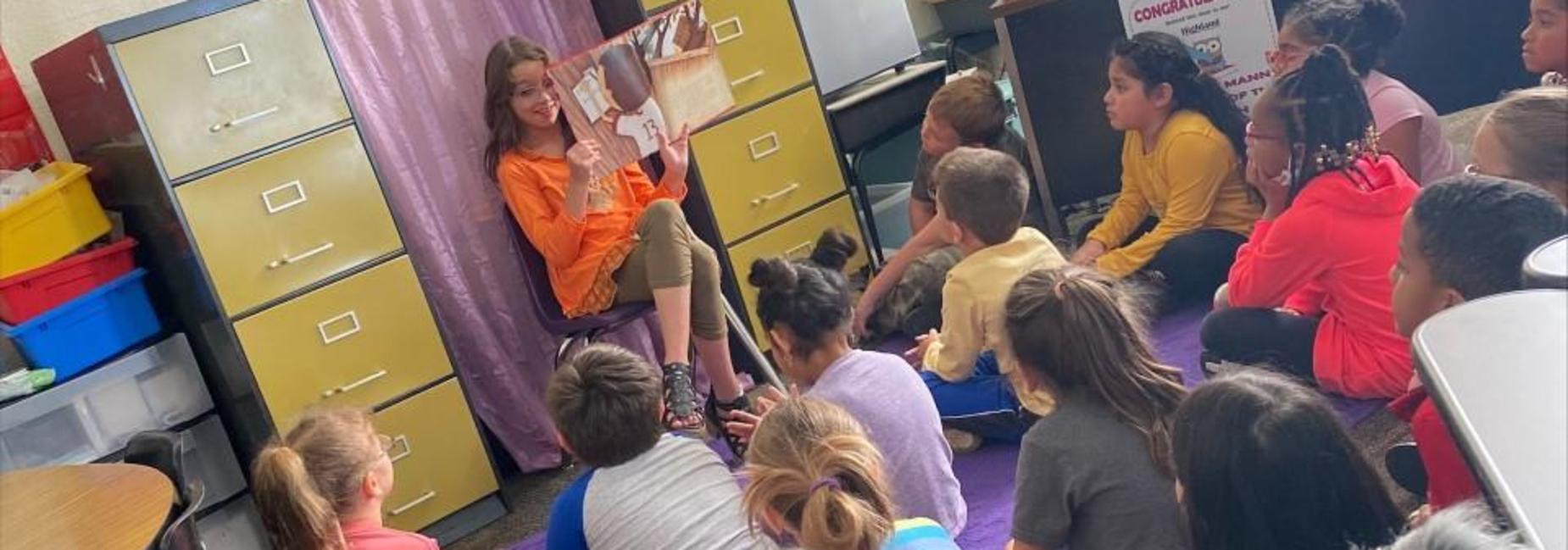 5th Grader reading to 1st Grade