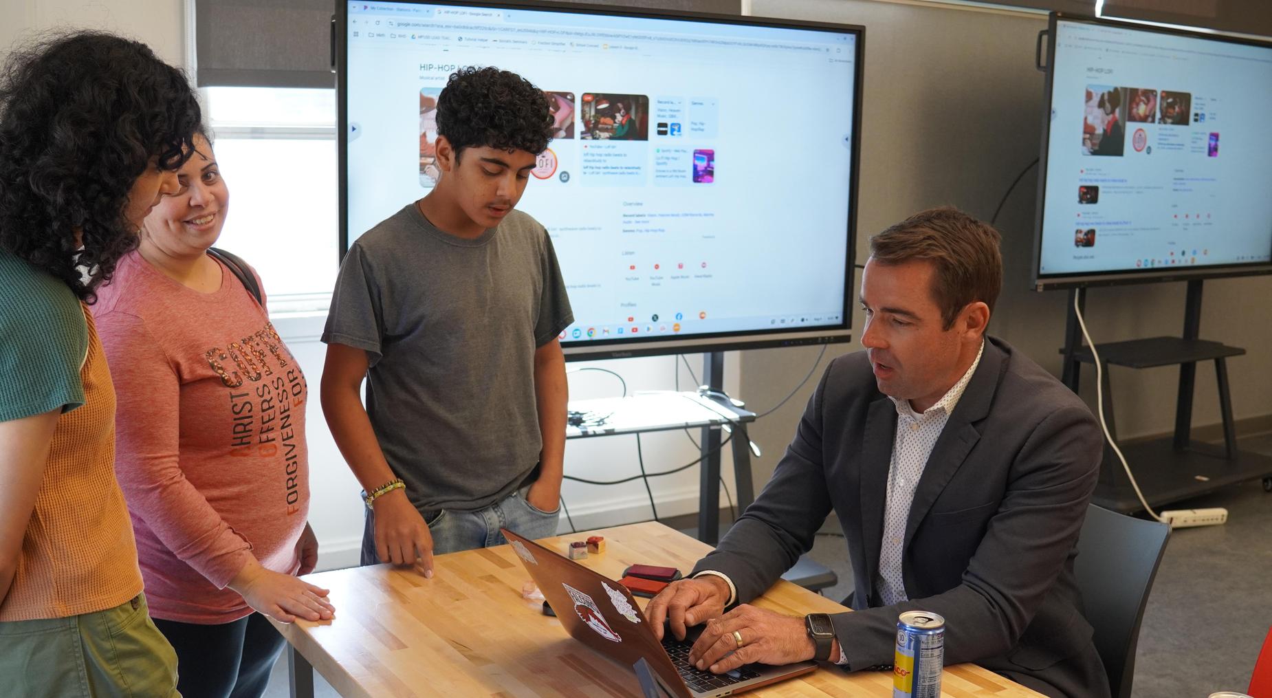 Parent and student checking in with Principal Leland Hansen for our Kick off event (August 4th, 2025)