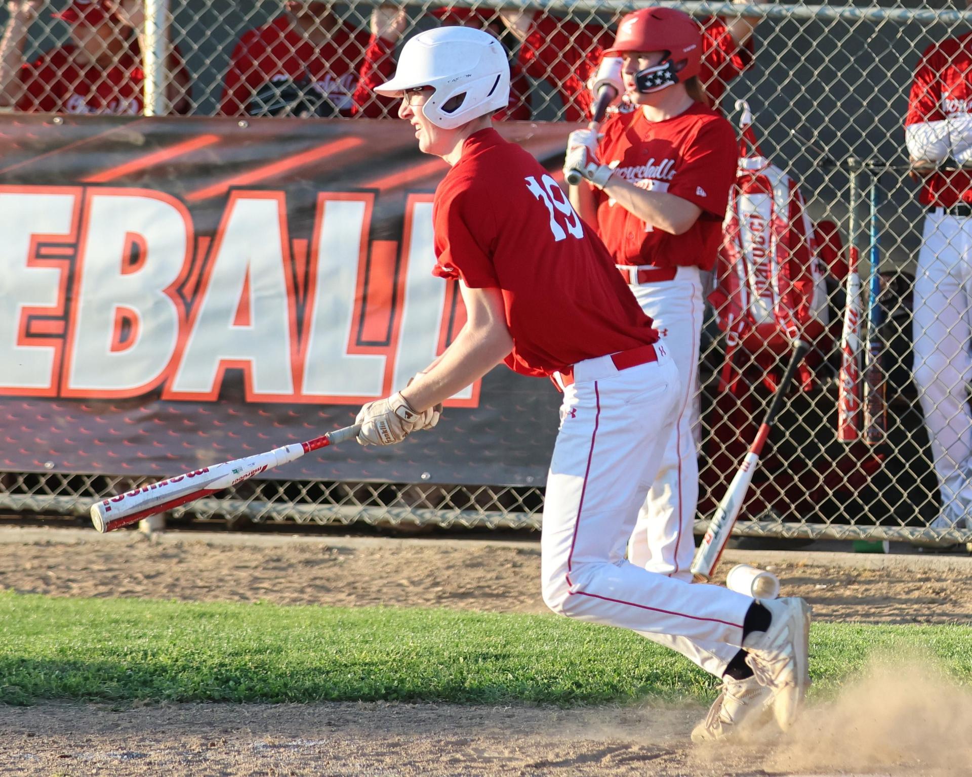 junior varsity baseball players in action