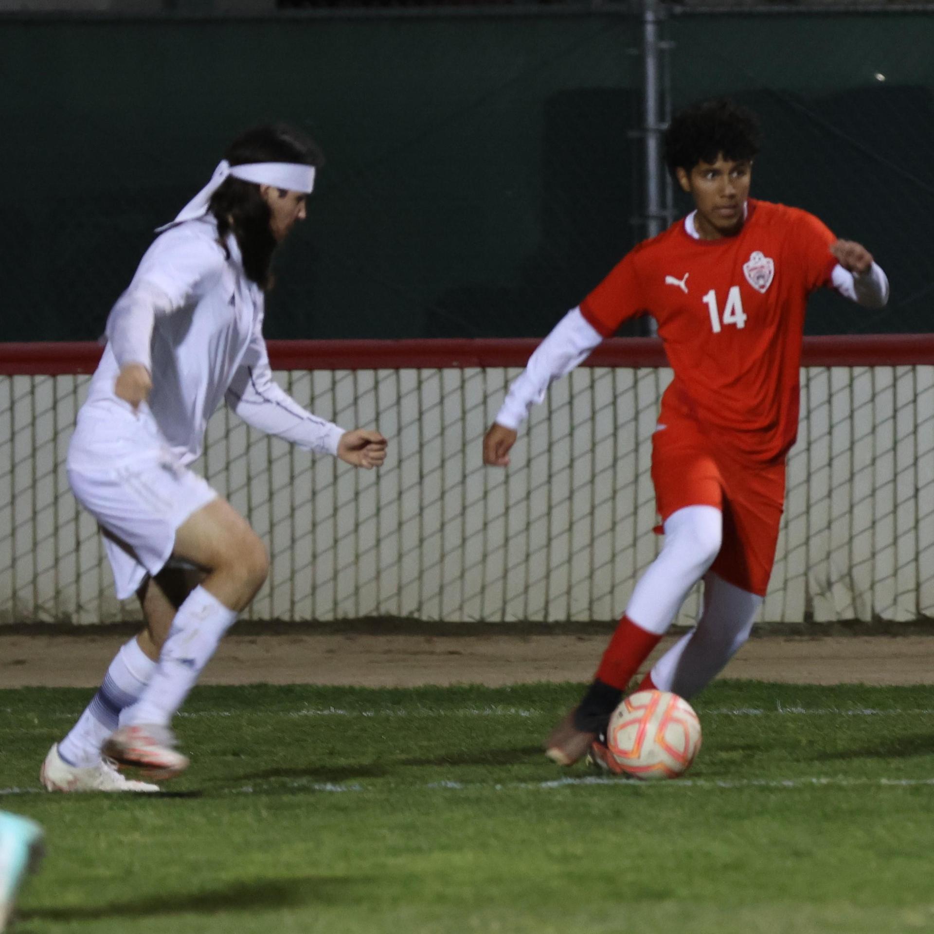 varisty boys soccer playing against yosemite