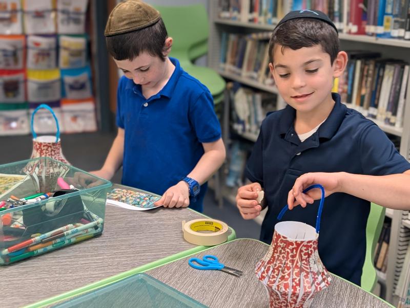 Boys making chinese lanterns