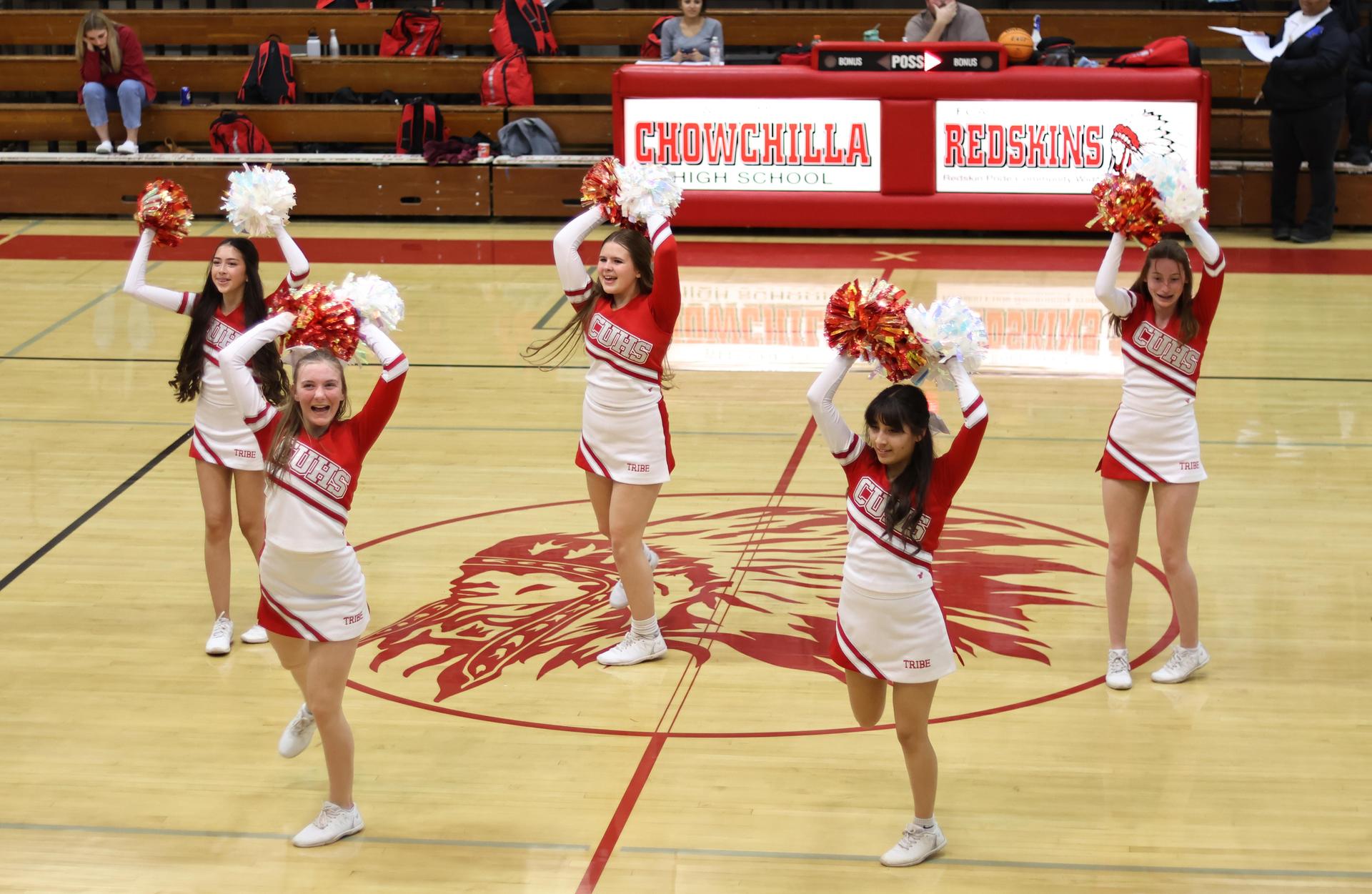 junior varsity cheerleaders cheering
