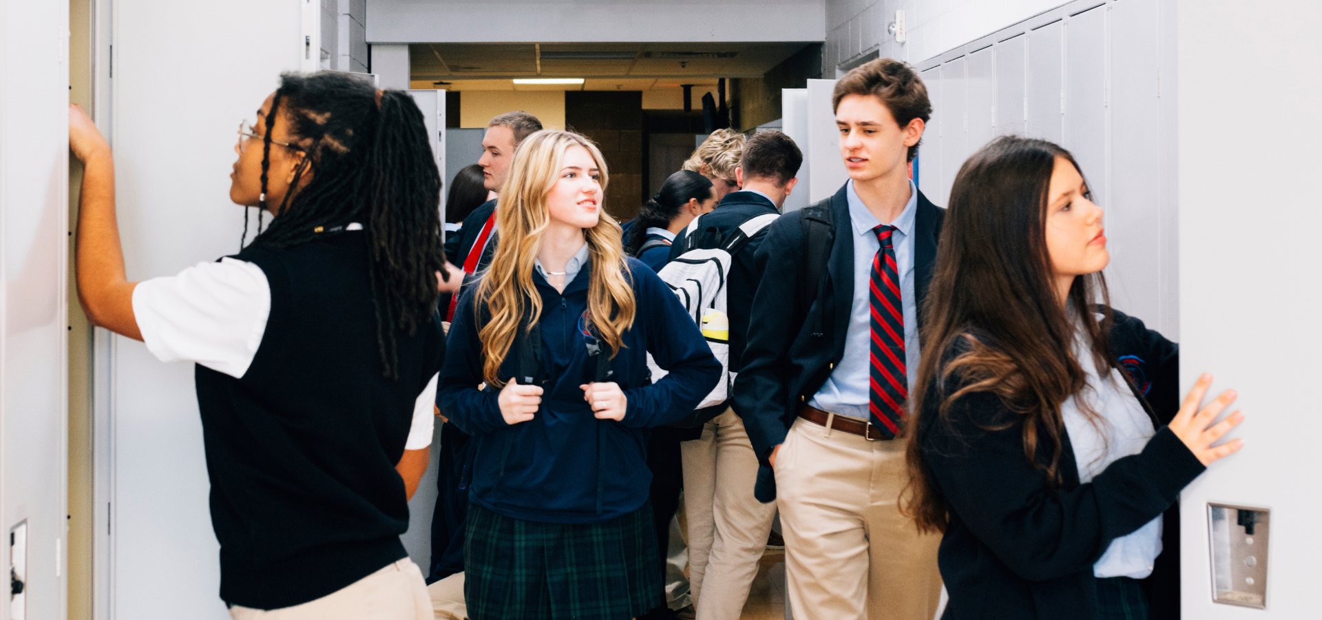 Students walking down hall.