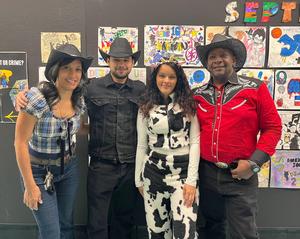 Staff members with cowboy costumes