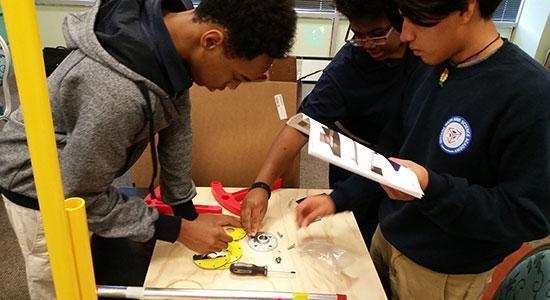 Students showing their science fair certificates