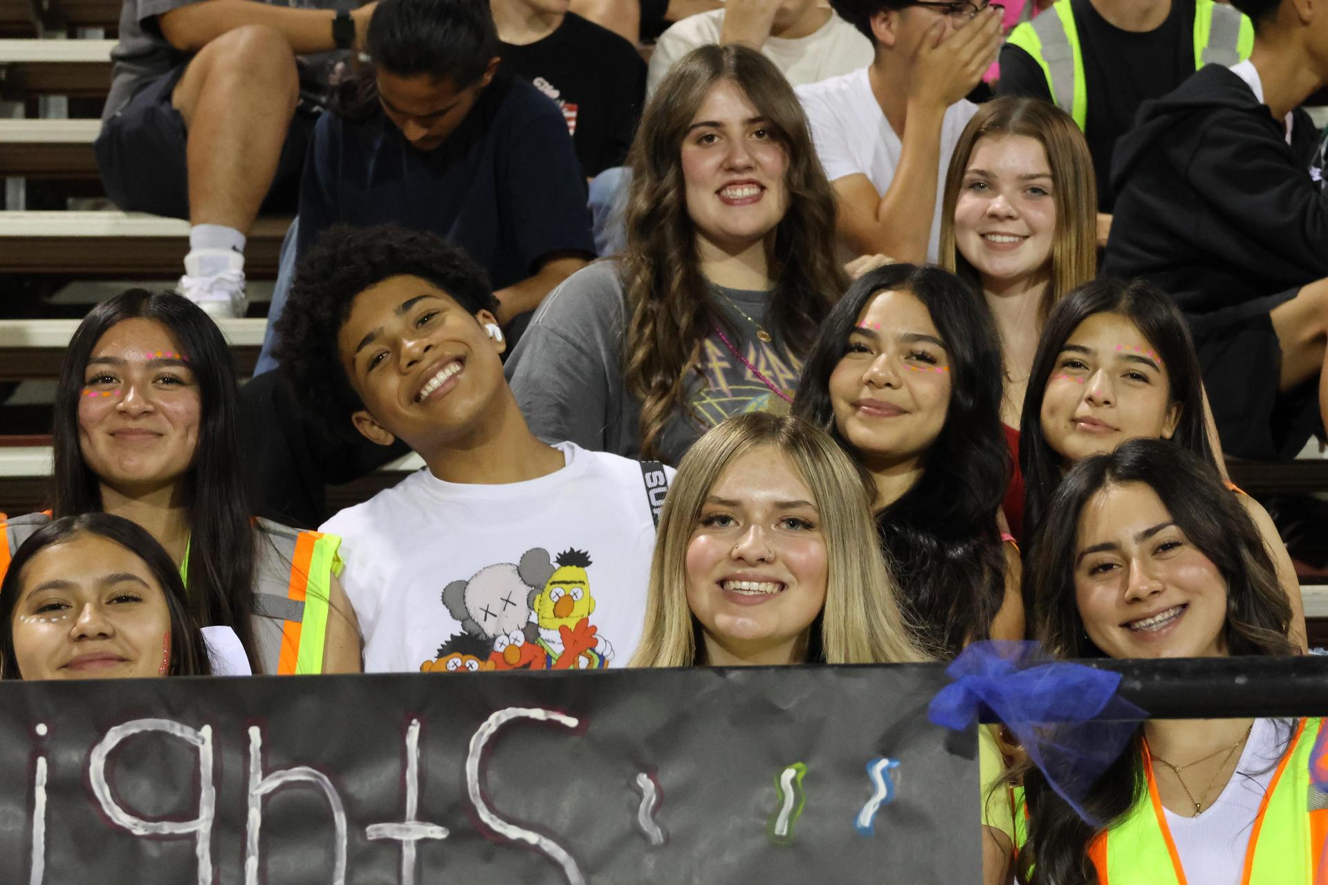 Students and community members enjoying the football game.